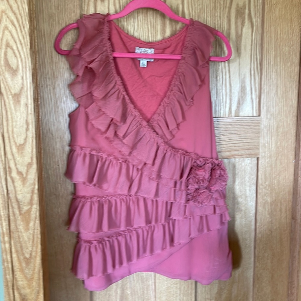 Anthropologie ruffled sleeveless top. Pinkish peach color.
